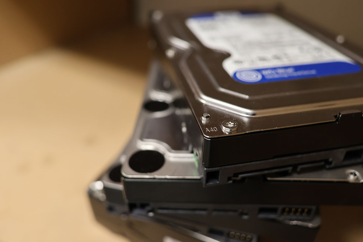 Stack of retired hard drives staged for secure destruction at an Oregon business